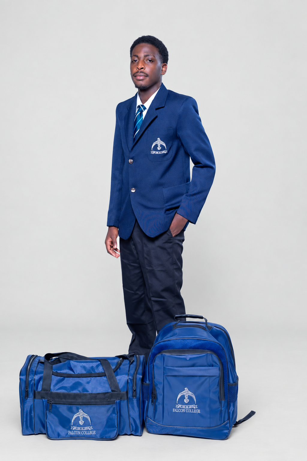 Navy school blazer with matching embroidered duffel and backpack