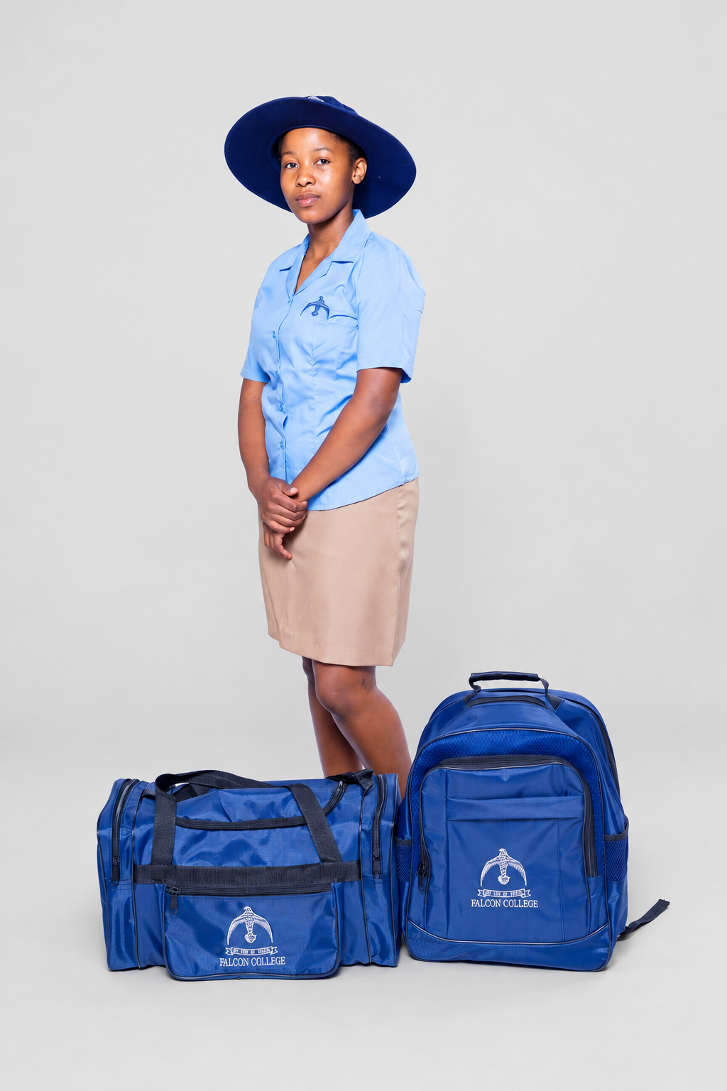 Blue school shirt, skirt and hat with matching school bags